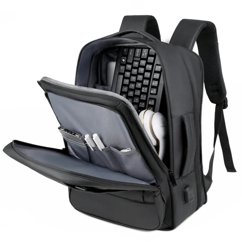 Black or grey waterproof Oxford cloth backpack with curved shoulder straps showing business and outdoor use