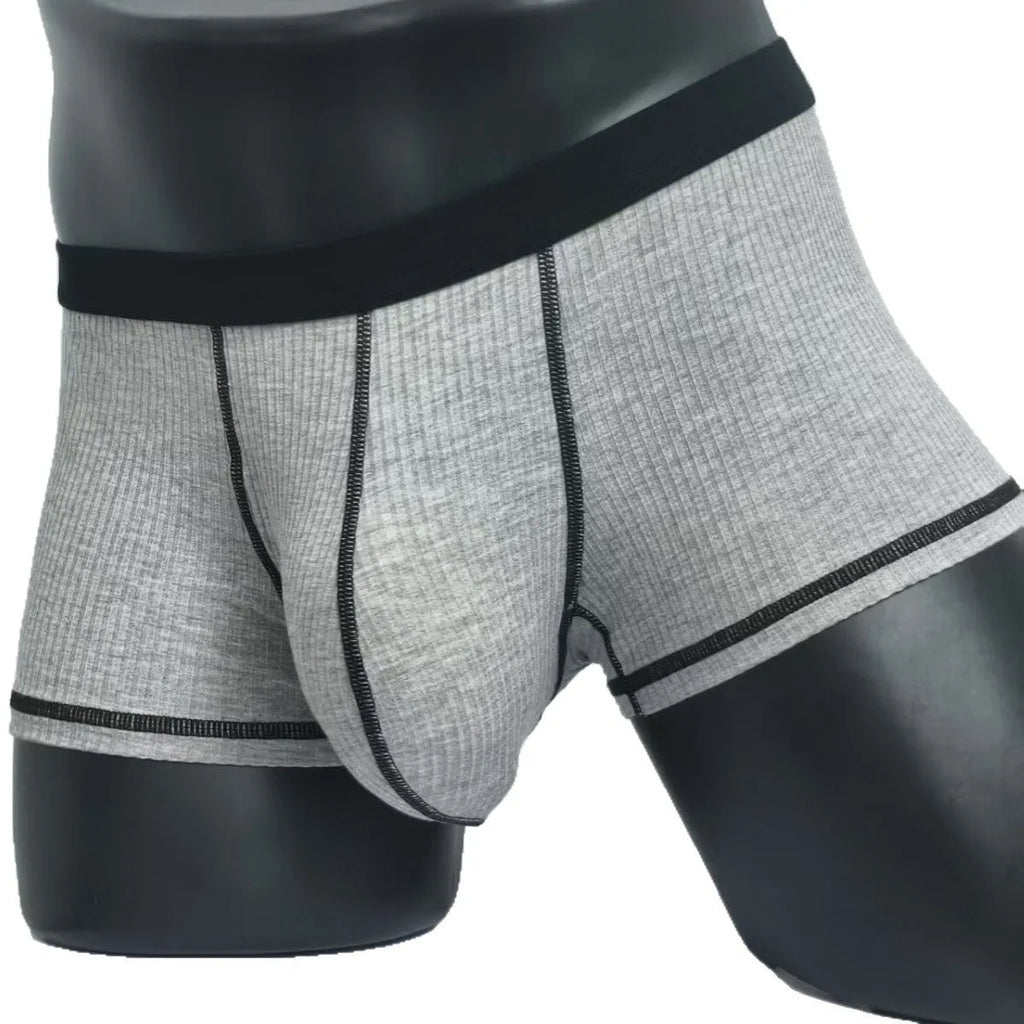 Men's thin fabric boxer shorts in solid colours showing hip lifting design