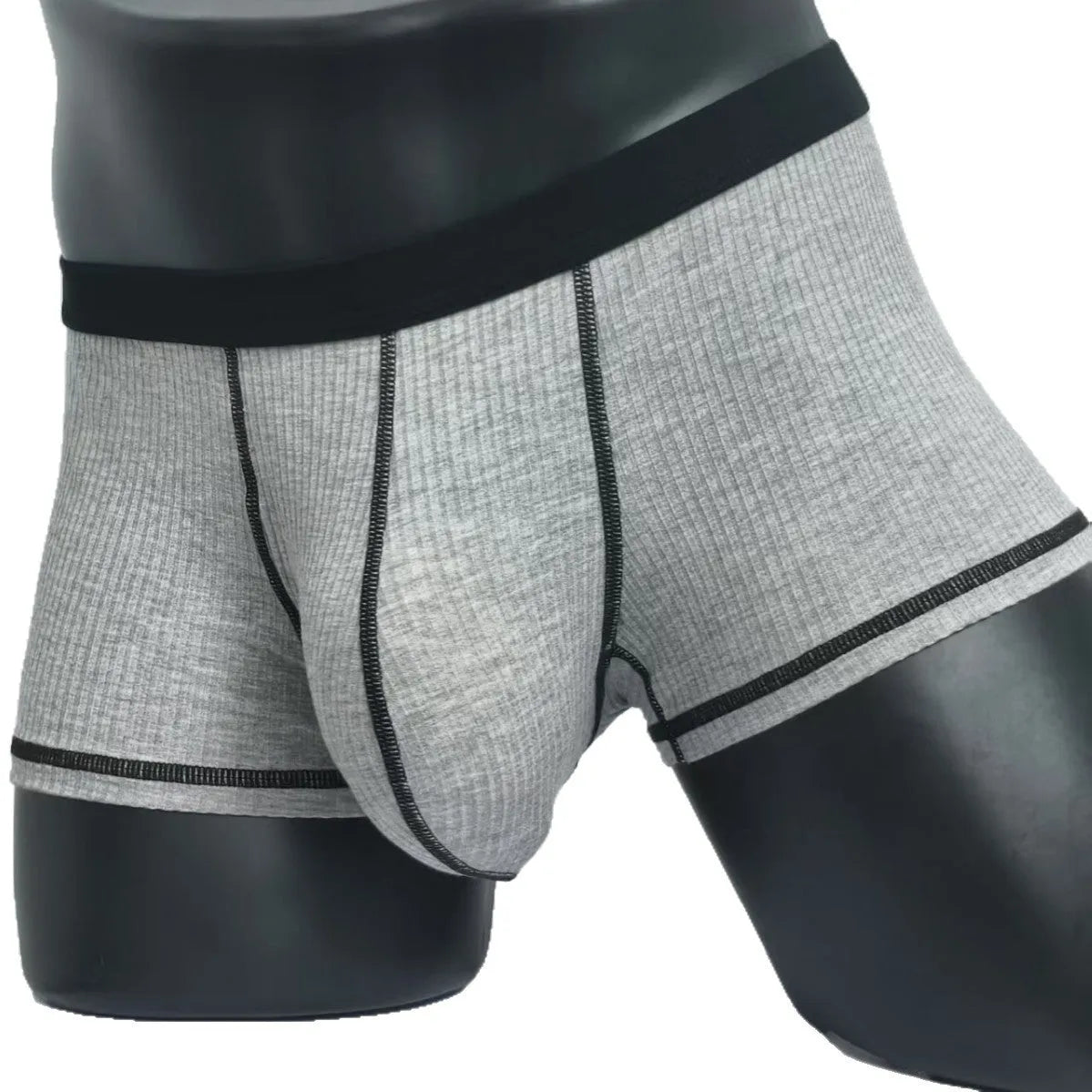 Men's thin fabric boxer shorts in solid colours showing hip lifting design