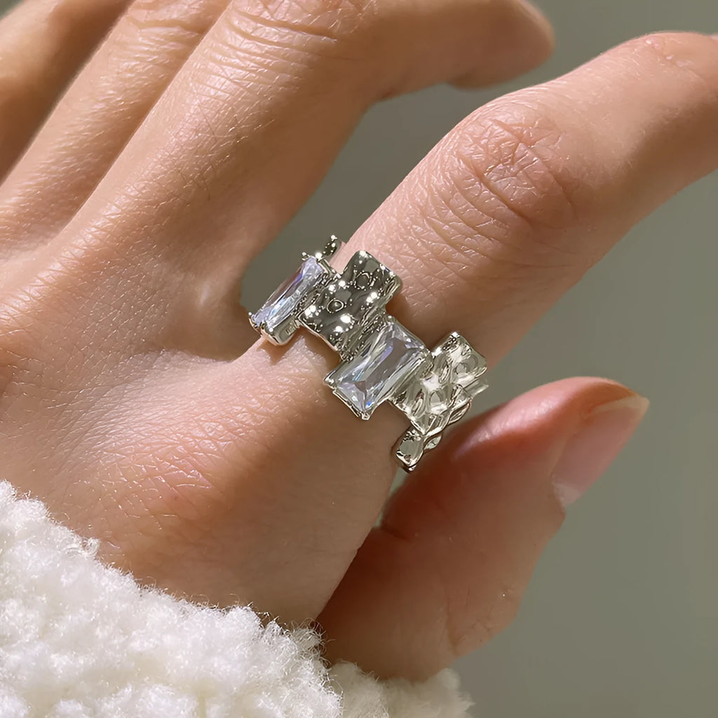 Silver geometric cross zircon ring with open gemstone design and three-dimensional decoration