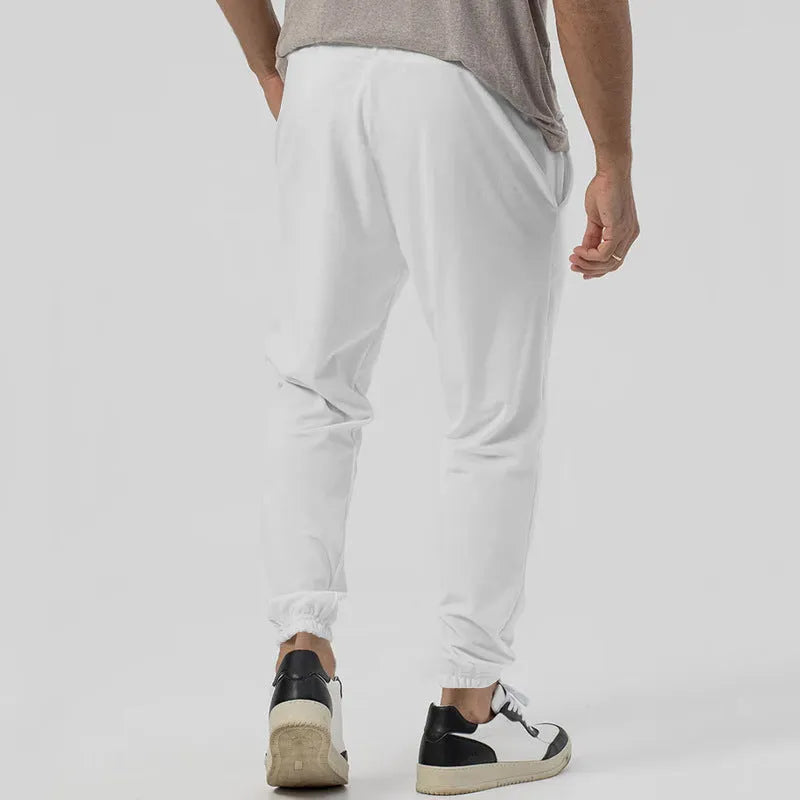 Men's grey cotton blend track sweatpants with straight leg design and mid waist