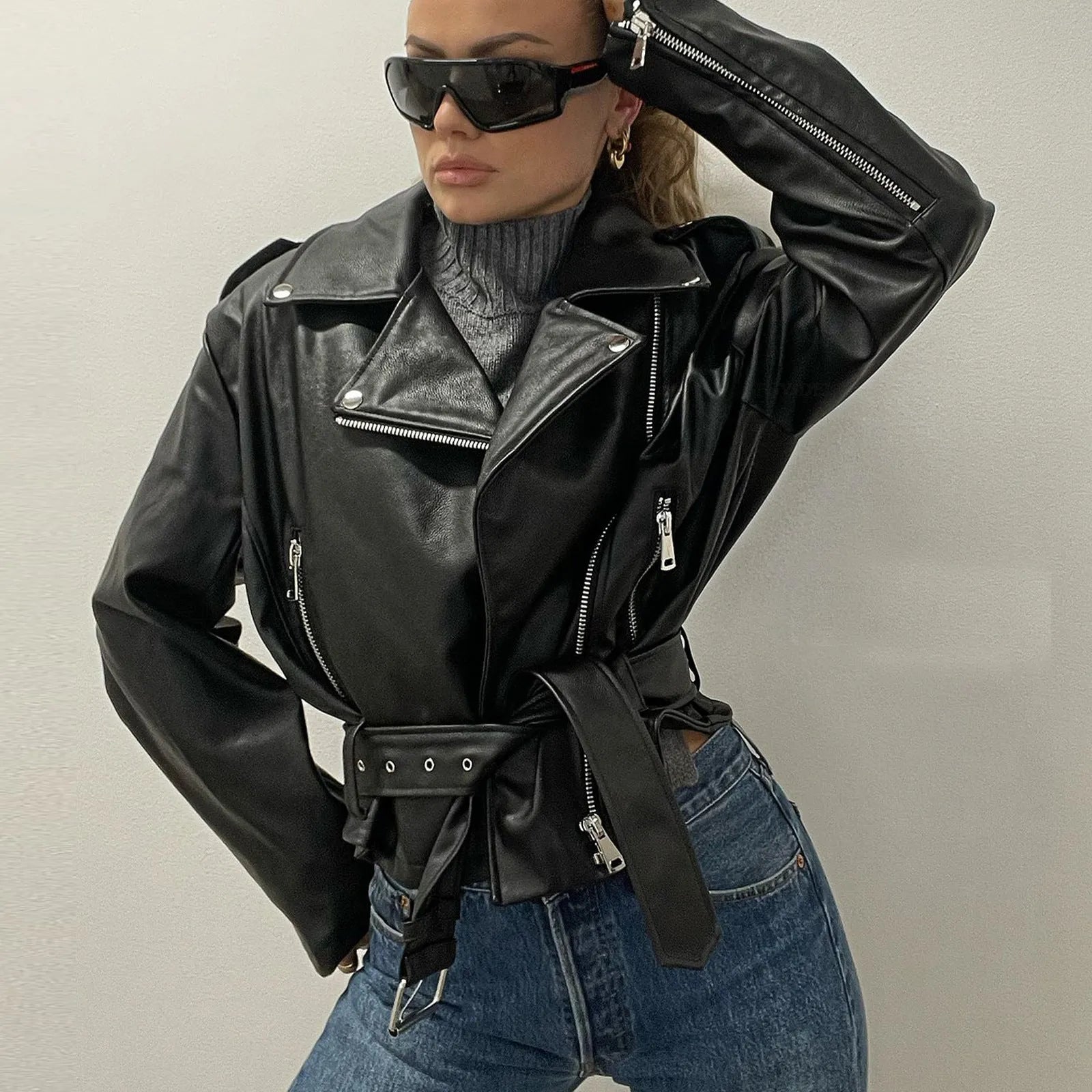 Punk style short belt lapel jacket with leather locomotive detailing in polyester fibre