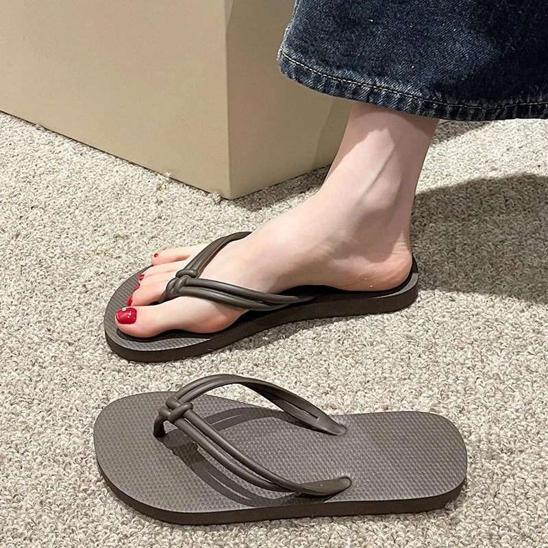 Men's casual flip flops with toe covering in PVC material, showing non-slip sole pattern and full foot enclosure design