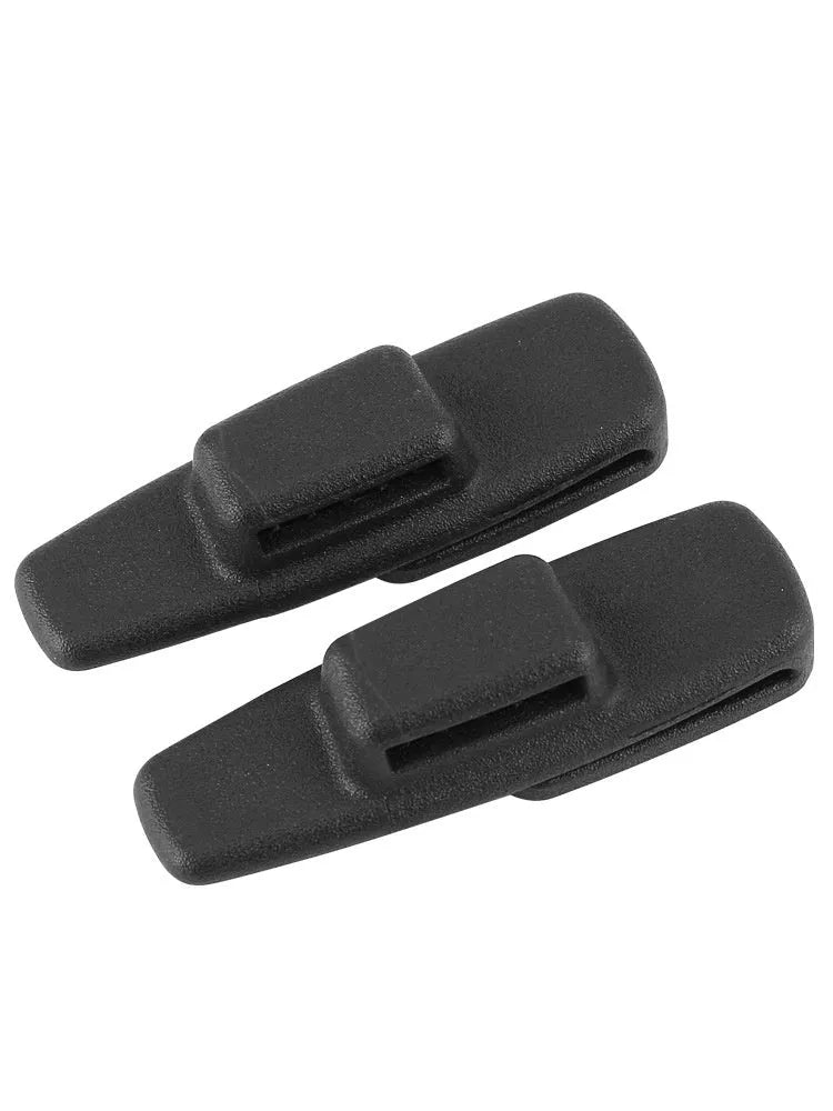 Black ABS plastic car seat belt stopper clips showing universal design for automotive use