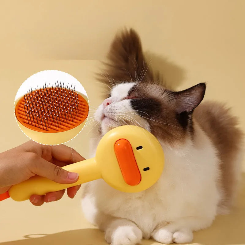 Small yellow duck-shaped pet comb with needle teeth for cat and dog grooming