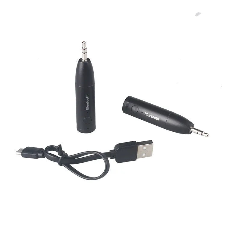 Black Bluetooth audio receiver with 3.5mm jack and USB charging port for car stereo connection