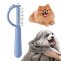Blue dinosaur-shaped cat brush with stainless steel bristles for self-cleaning grooming