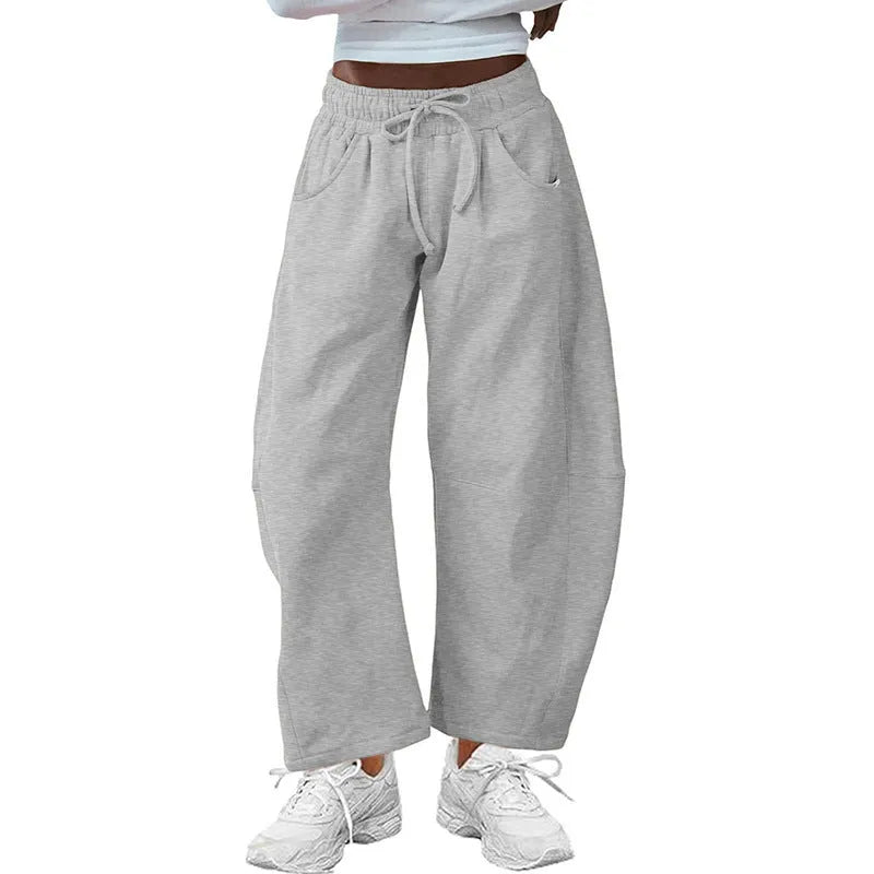 Women's loose cropped sweatpants with drawstring waist and side pockets in apricot colour