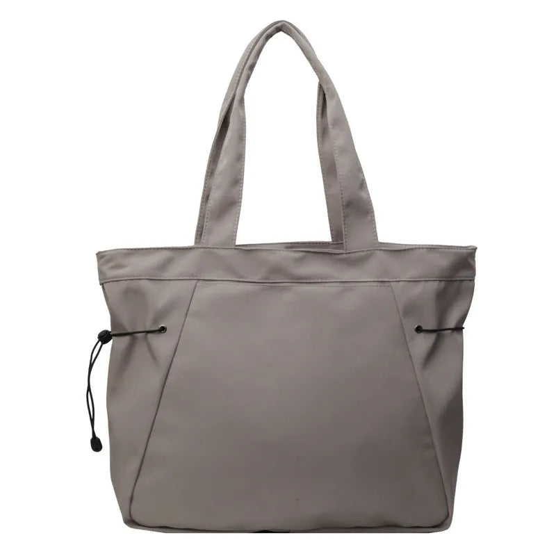Oxford cloth folding tote bag in five colour options: black, brown, dark grey, light grey and purple.