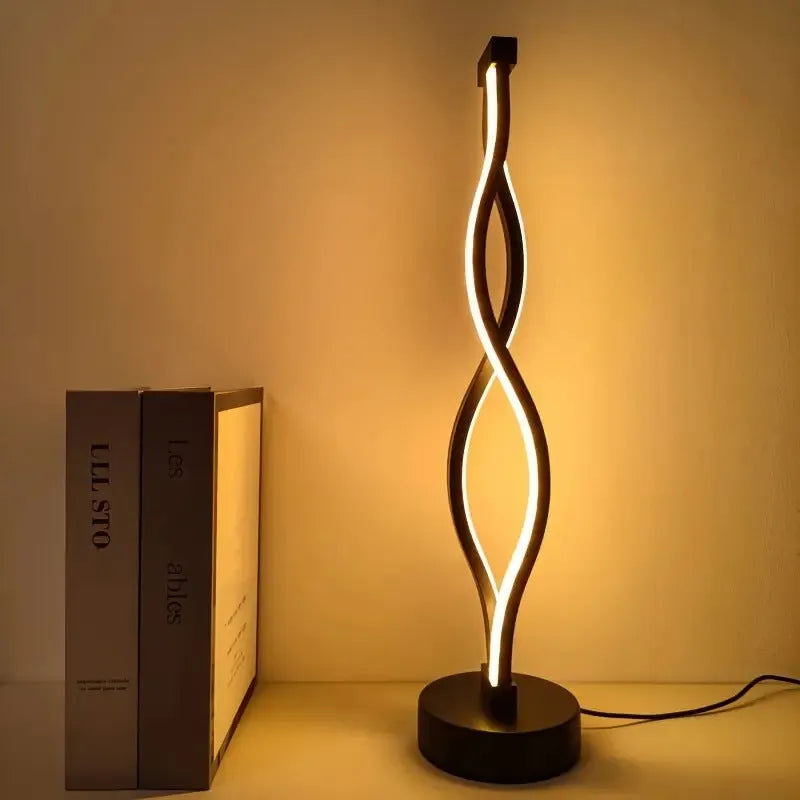 Black aluminium desk lamp with touch dimming controls and three-colour lighting options
