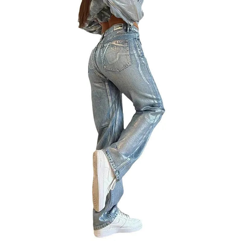 Women's blue high waist straight leg jeans with silver contrast detailing on denim fabric