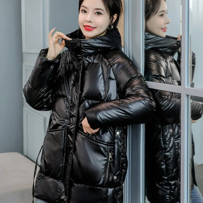 A woman's loose-fitting, thick, hooded winter jacket in a choice of colours on a size chart background.