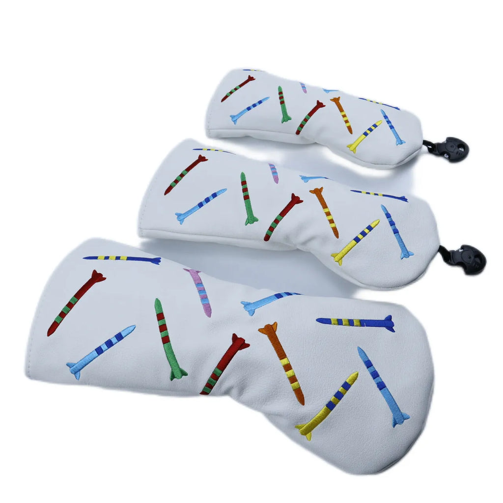 Set of black and white PU golf poles in three different sizes on a plain background