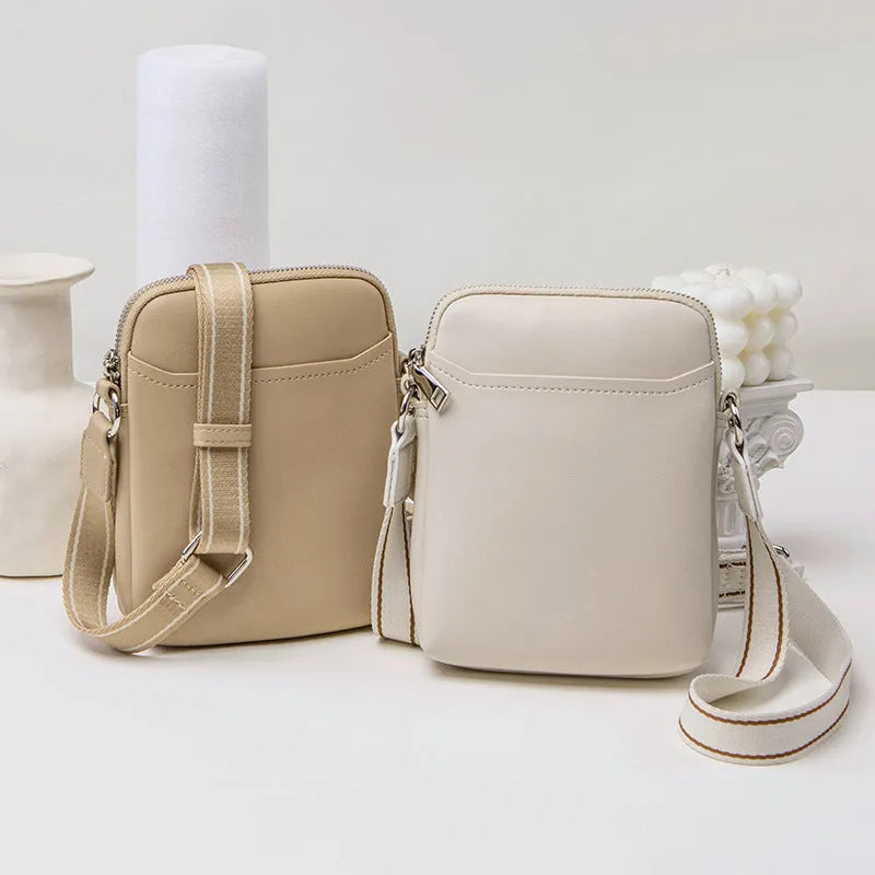 Solid colour PU mobile phone crossbody shoulder bag in black, beige, khaki, or green.
