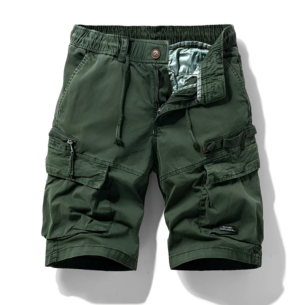 Men's army green cotton shorts with multiple zip pockets, shown with a Korean-style above-the-knee cut.