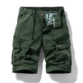 Men's army green cotton shorts with multiple zip pockets, shown with a Korean-style above-the-knee cut.