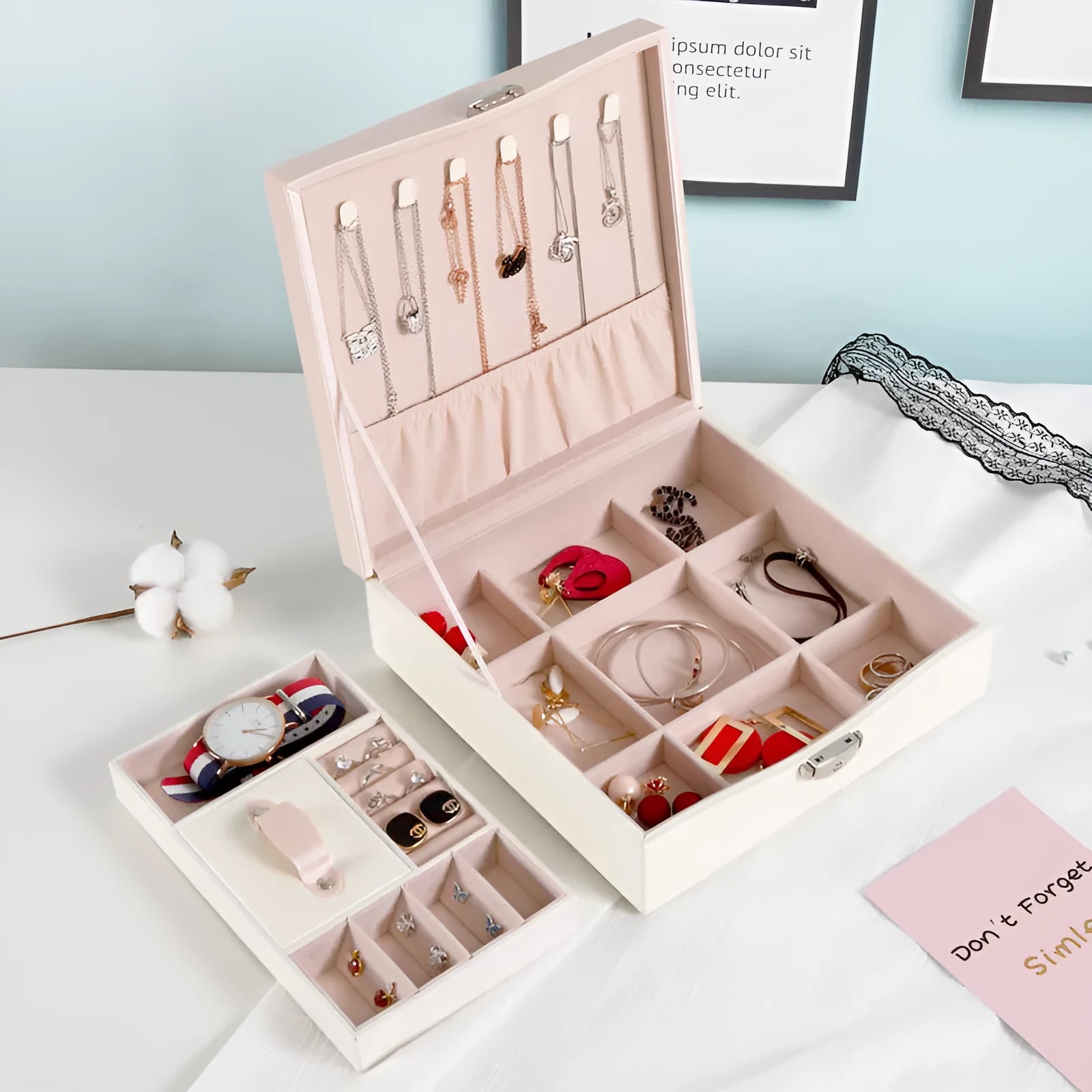 Red and white jewellery storage box with compartments for necklaces and rings