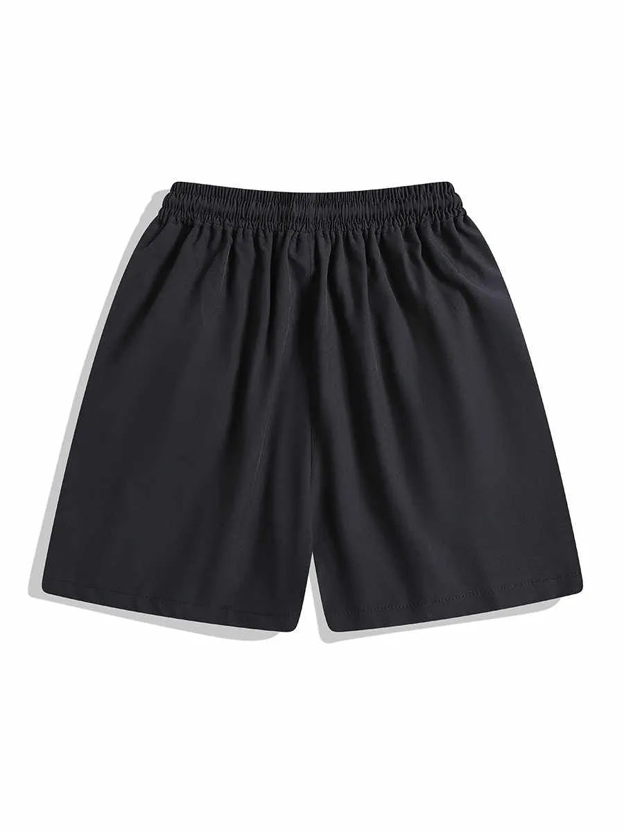Man wearing black loose-fitting quick-dry training shorts with an elastic waist, suitable for sports and casual wear.
