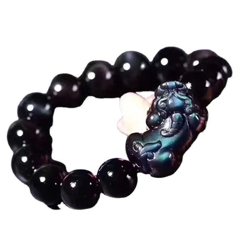 Natural ice colour obsidian crystal bracelet with spherical beads on wrist