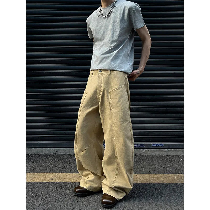 Men's straight leg khaki cotton trousers on a hanger, showing classic casual style.