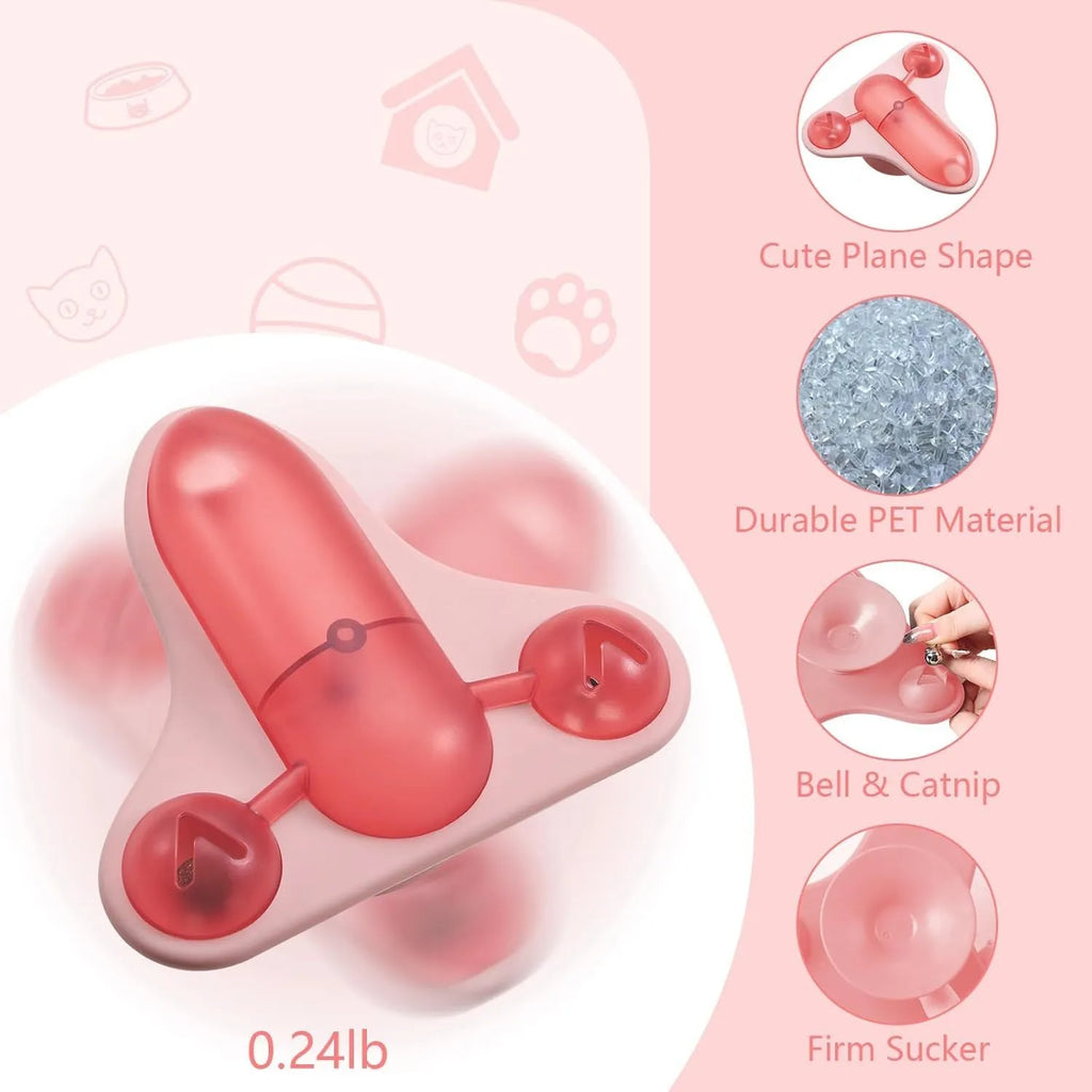 Interactive pet puzzle toy with blue base, a central snack cabin, a bell, and catnip attached. Shows suction cups on bottom.