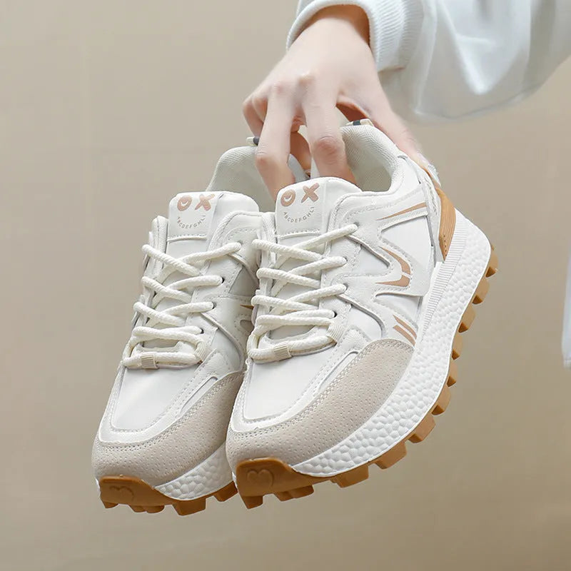 Women's black platform sports casual shoes with round toe and front lace-up closure on flat background