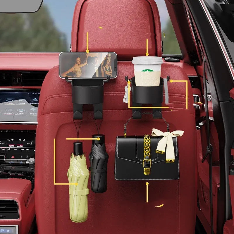 Black plastic car seat back organiser with cup holder and hook, mounted on a car headrest.
