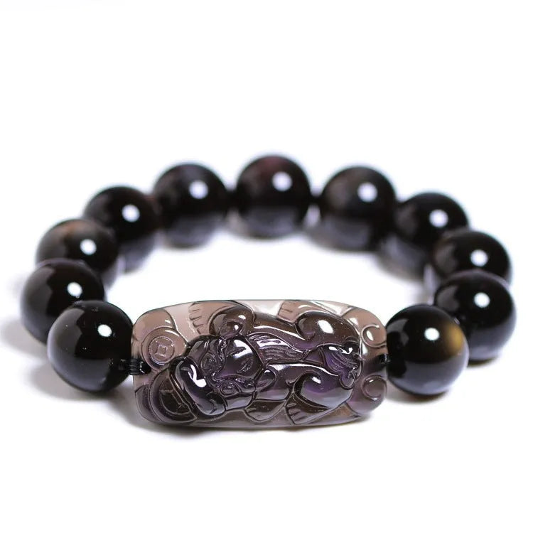 Polished crystal Pi Xiu bracelet with Ice Stone design on a wrist, showing geometric ethnic style.