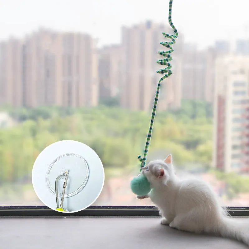 Hanging cat toy with inflatable ball on spring stick and suction cup base for kittens