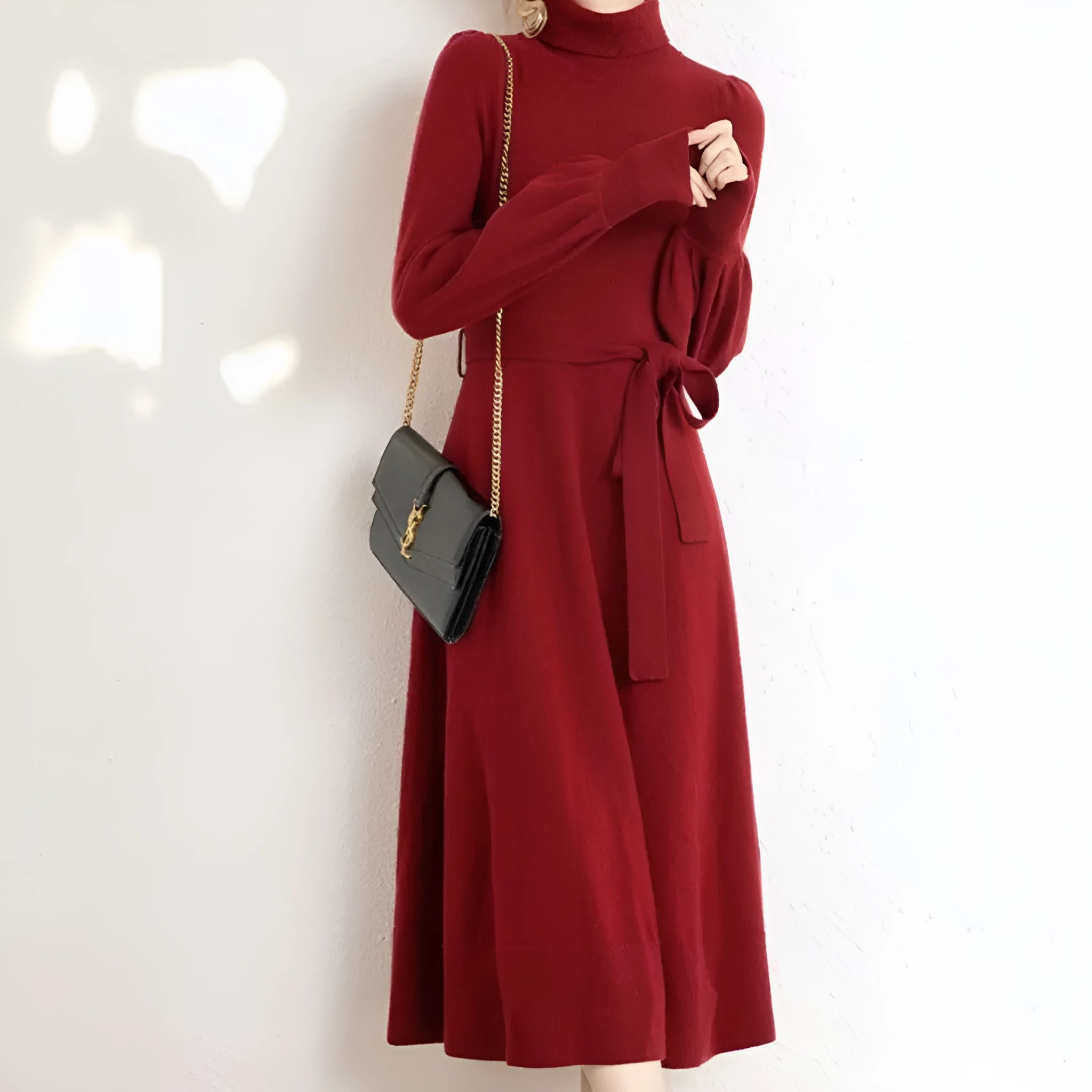 Rose red turtleneck knit dress with long sleeves, elastic waist, and a loose flowing mid-length skirt.