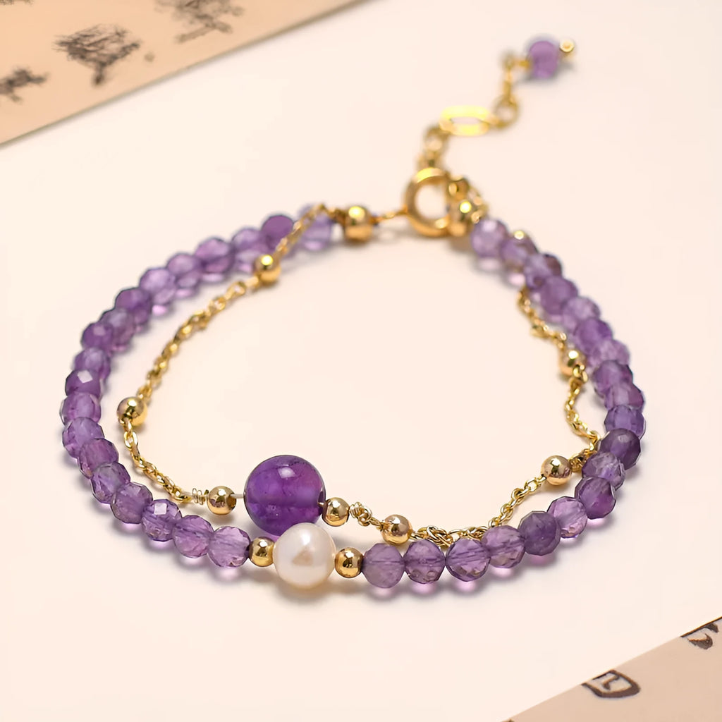 Close-up of a women's amethyst crystal bracelet with a diamond shape and Chinese style design.