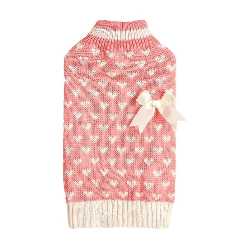 Red love heart design on a pink acrylic dog sweater for a small dog.