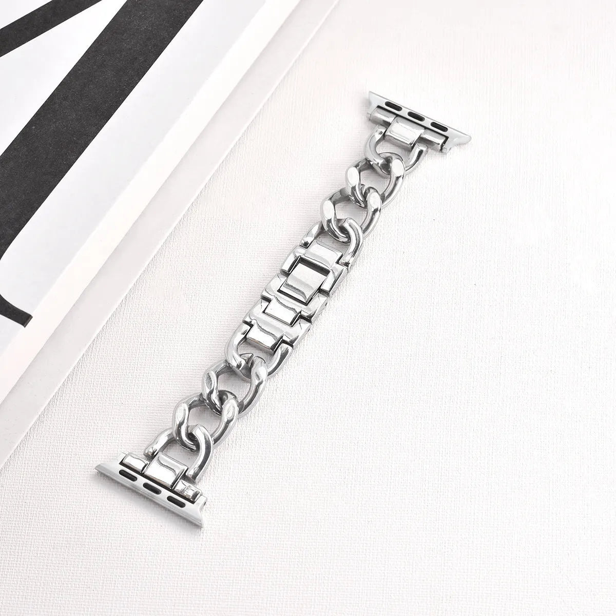 Denim chain pattern metal watch strap for Apple Watch in silver, shown with 22mm lugs.