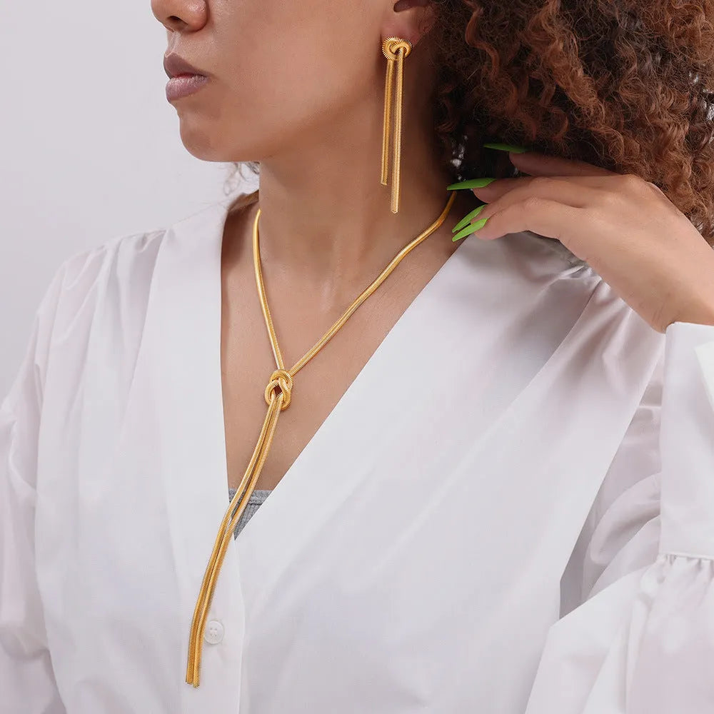 Gold titanium steel knotted tassel necklace and matching earrings set with snake chain