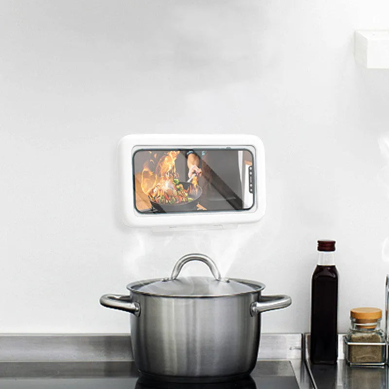 Waterproof plastic phone holder with clear anti-fog window showing smartphone inside, mounted on bathroom tile