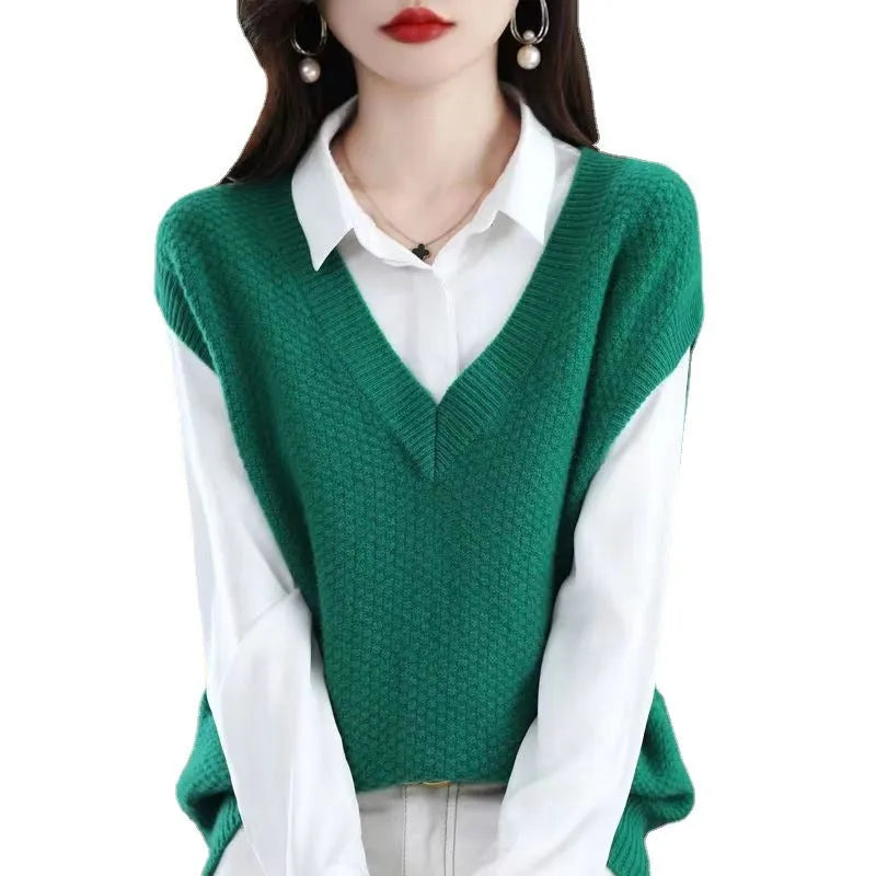 Women's beige V-neck sleeveless knitted vest with a raised 3D pattern texture.