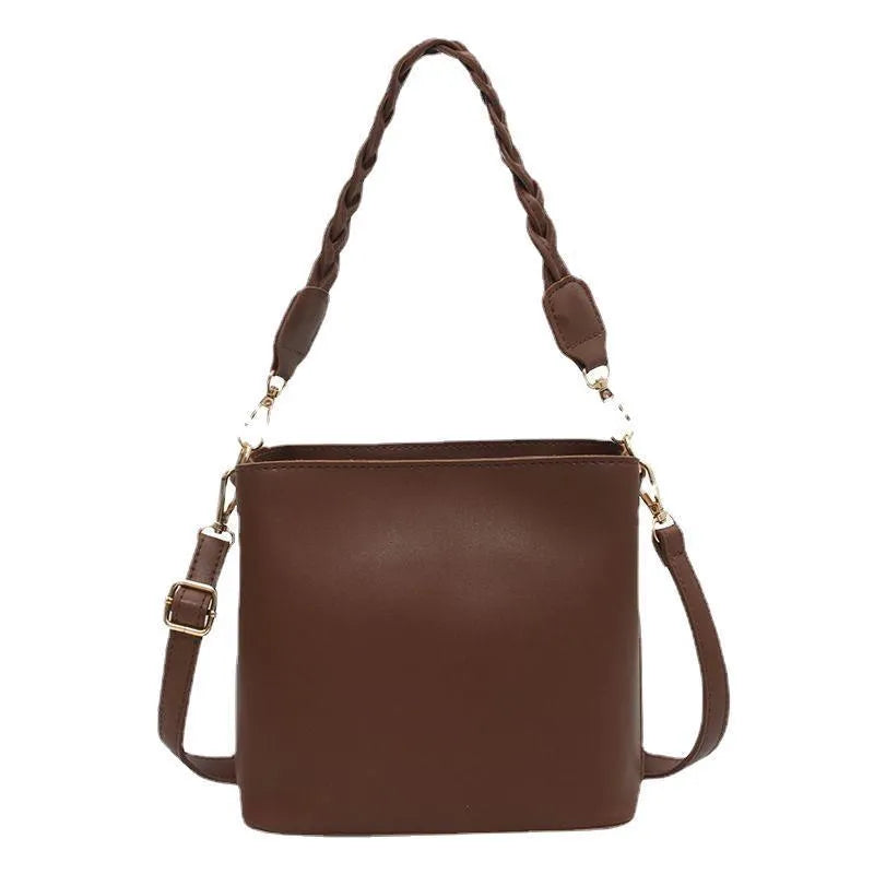 Retro-style khaki PU underarm bucket bag with a woven pattern and a crossbody strap.