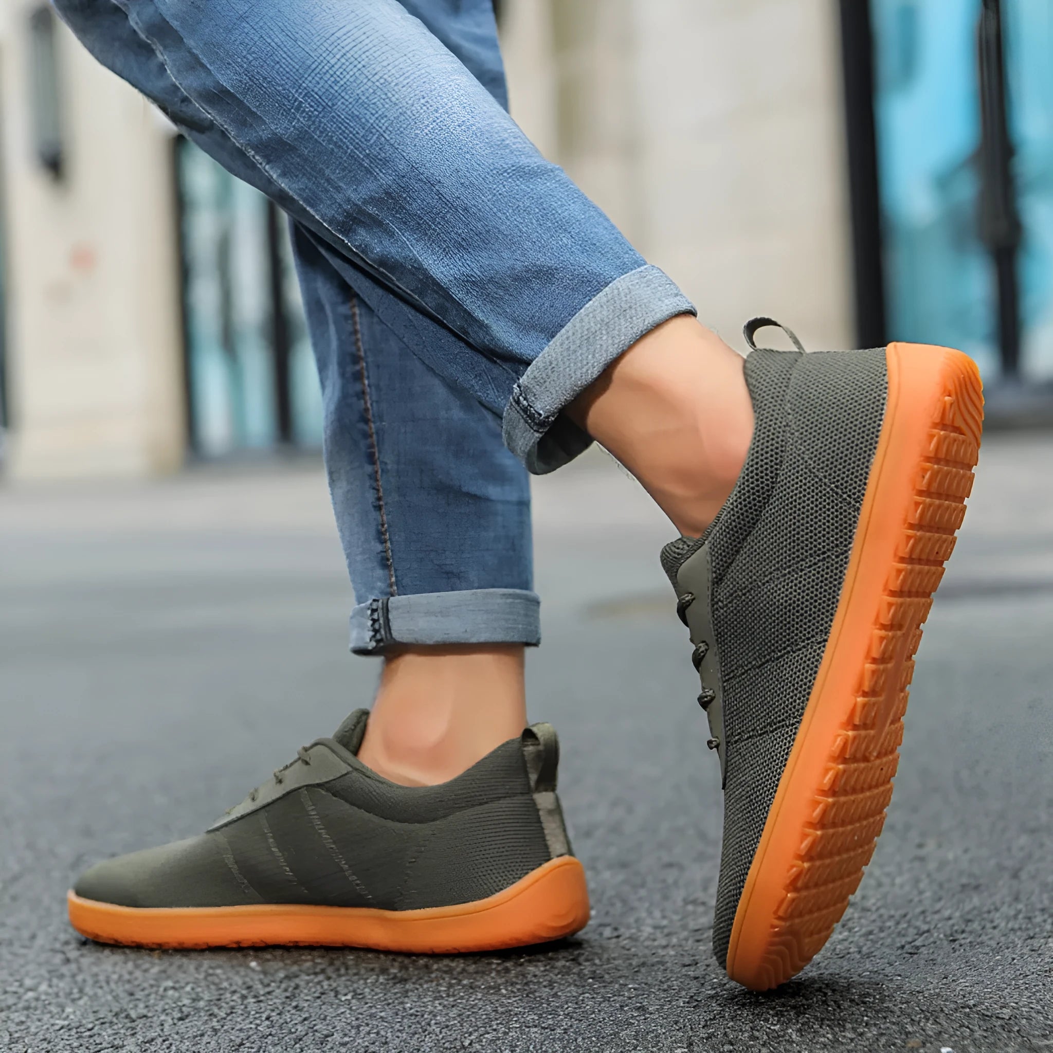 Men's low-top casual walking shoes in black with Flyknit upper, round toe, and rubber sole on a plain background.