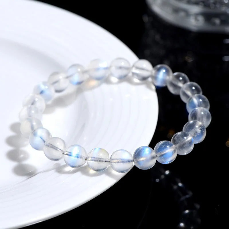 Natural cream body blue moonlight crystal bracelet with grinding treatment showing multiple size options