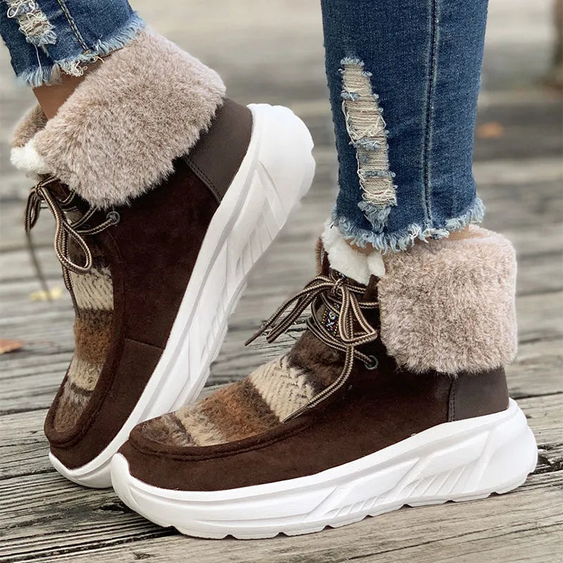 Women's beige lace-up snow boots showing front tie design and mid-top height with plush lining