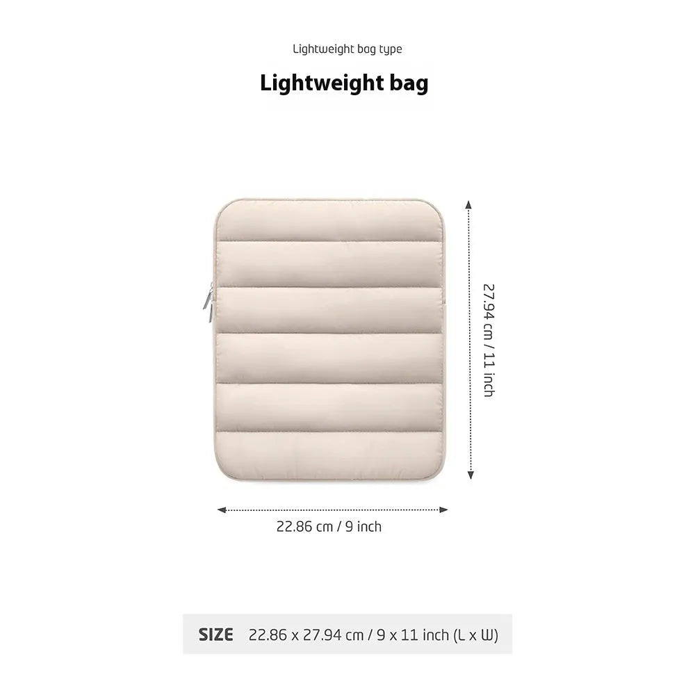 Fluffy air feeling laptop sleeve in black, open to show soft lining, next to an 11 inch tablet.