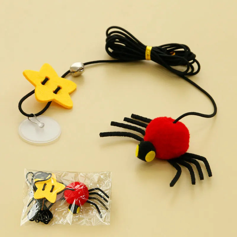 Red cat hanging door toy with elastic rope, feather, bell, and spider decoration