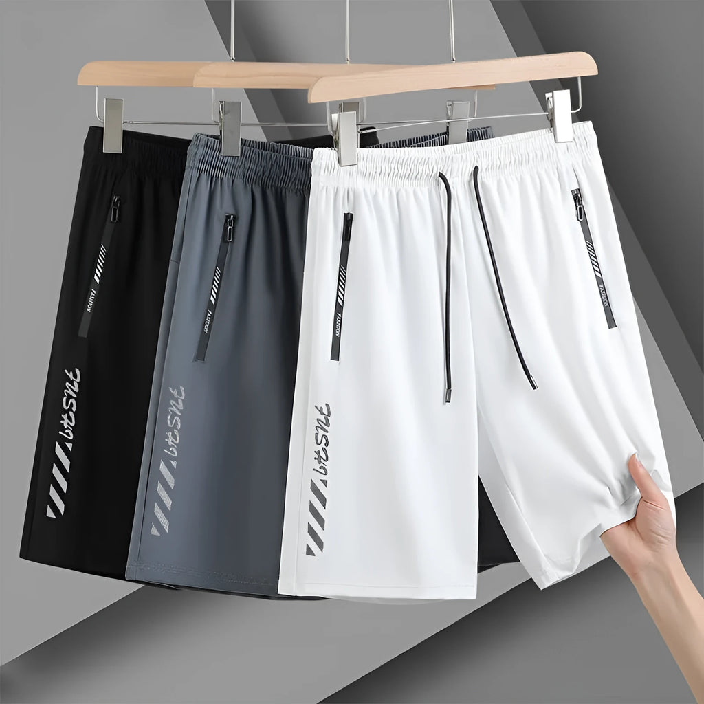 Man wearing black loose-fit quick-dry nylon sports shorts for summer activities