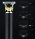 Black rechargeable electric hair clipper with four comb attachments and a cleaning brush on a table.