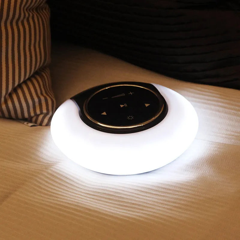 Blue foldable Bluetooth desk lamp speaker with touch controls for dimmable LED lighting.