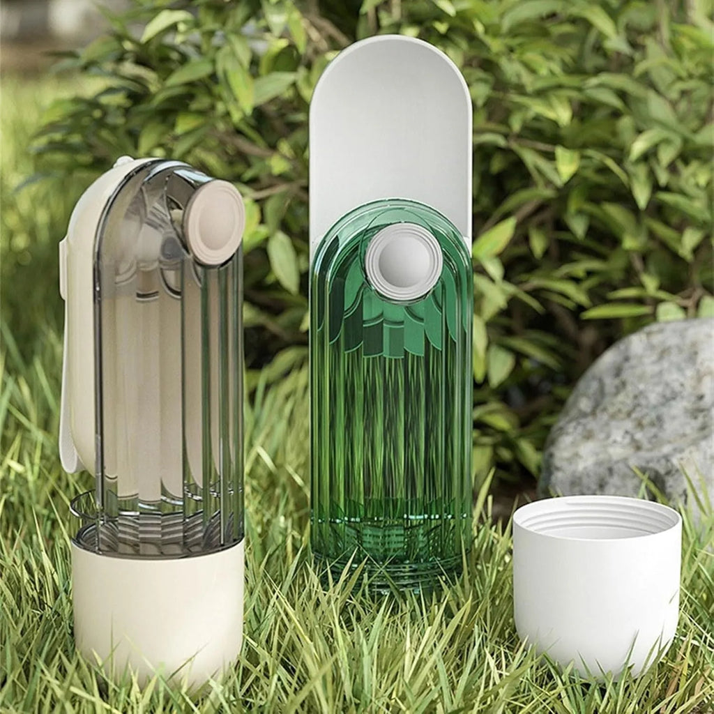 Beige foldable dog water bottle with integrated food container for outdoor walks.