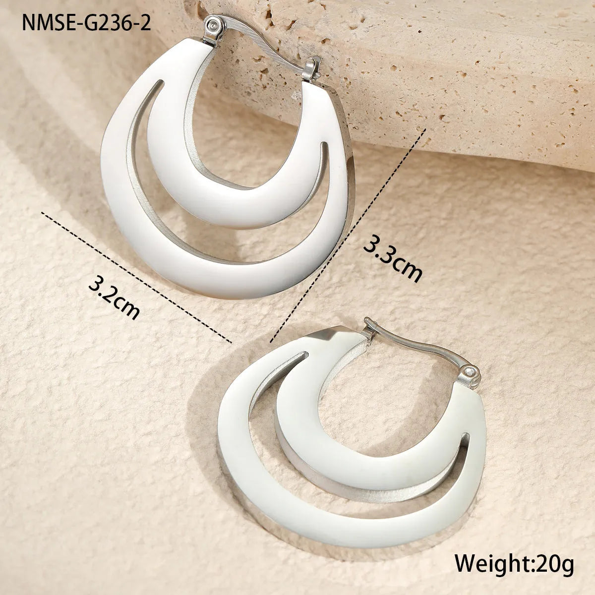 Geometric French earrings with circular ring design in gold and steel metallic finishes