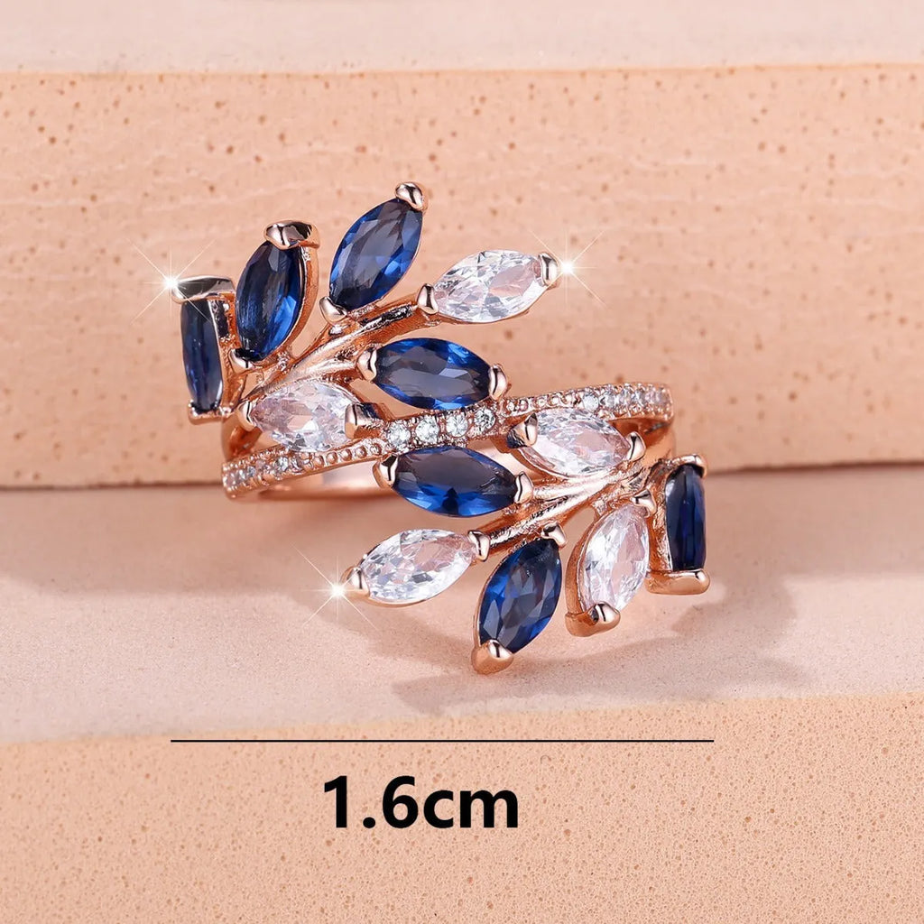 Adjustable copper ring with horse eye zircon leaf design in rose gold sapphire blue colour