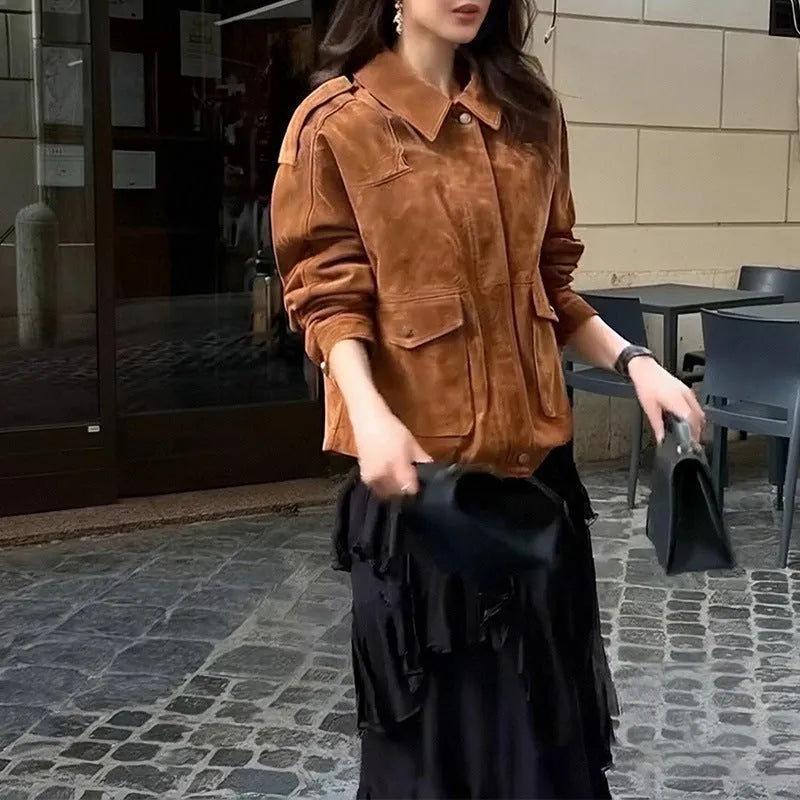 Women's bright brown suede coat with regular sleeves on a hanger