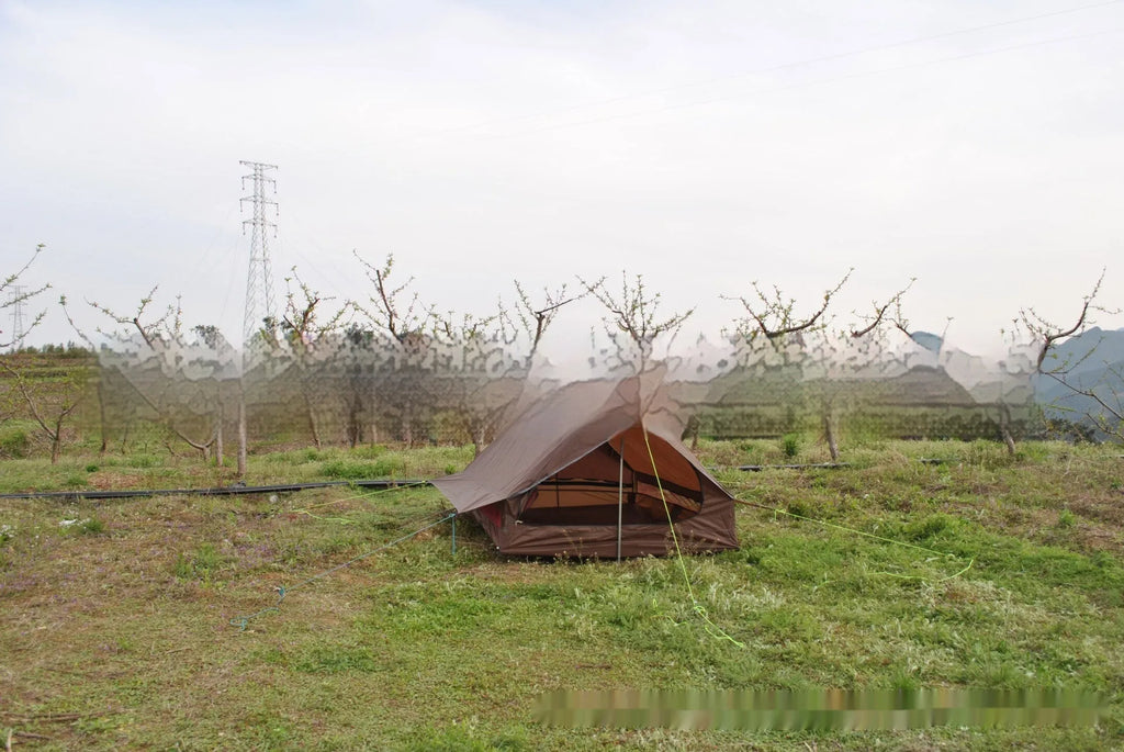Brown A-line cabin tent setup with hiking pole supports showing spacious interior and waterproof fabric construction